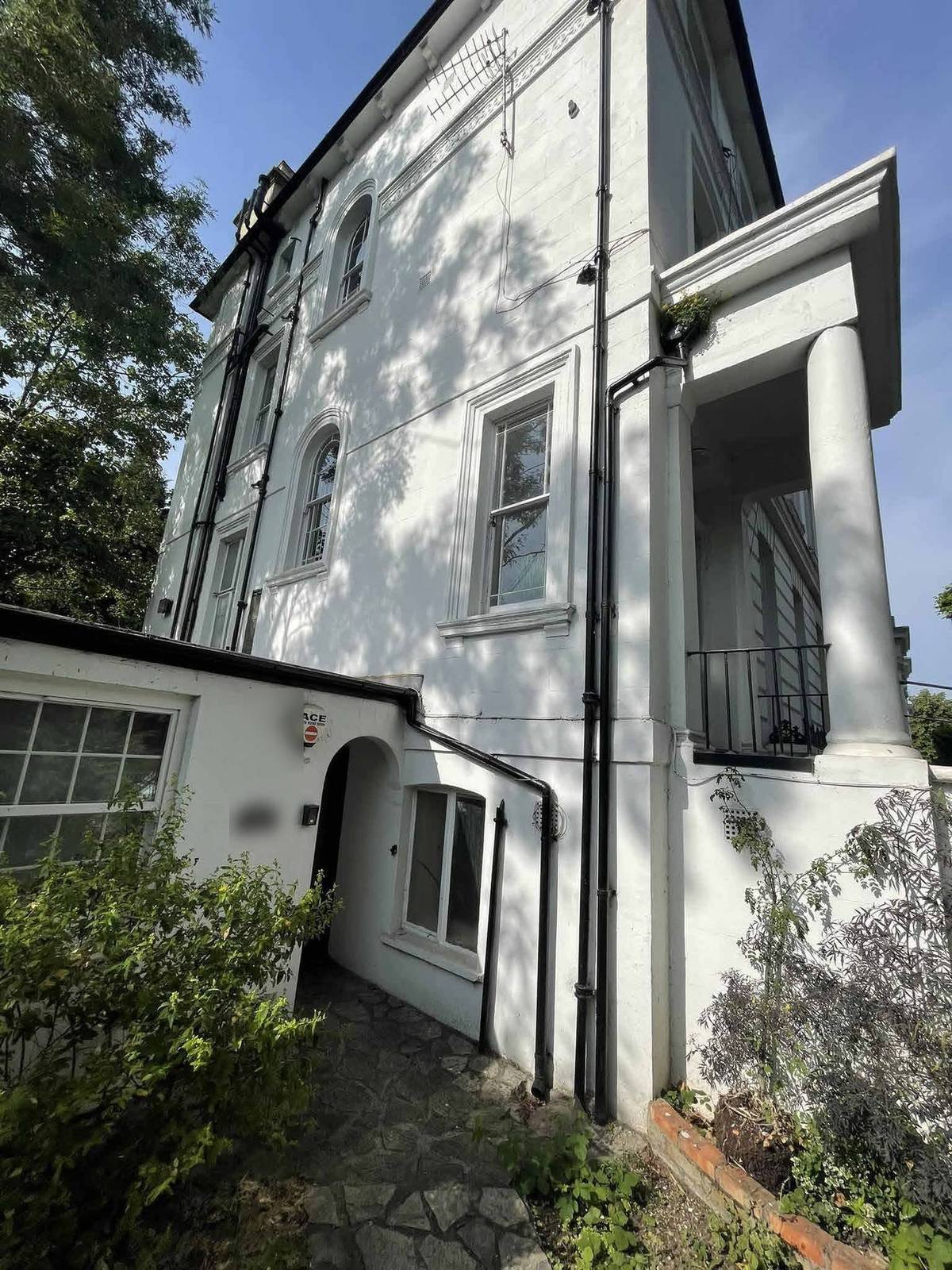 Existing side return and garden flat entrance, which the scheme relocates to the front elevation (site photo sheet)
