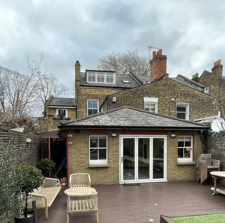 Existing rear elevation and garden before the works (Design & Access Statement)