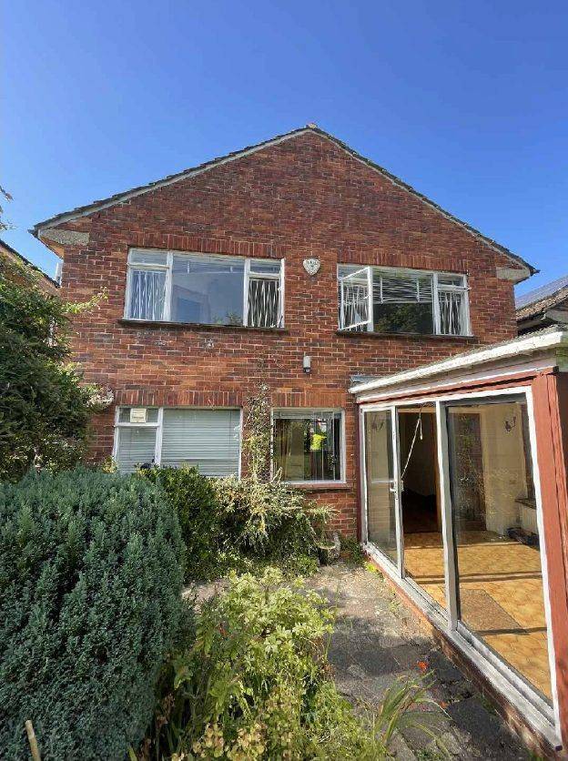 The rear of the house with the existing sunroom to be replaced (site photographs)
