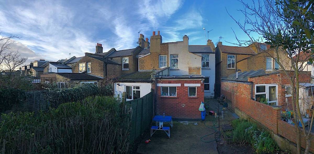 Rear of the house and the neighbouring terrace before works, showing the existing outriggers (Design and Access Statement)