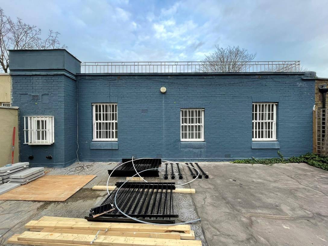 The rear first-floor terrace and elevation before the works (Design and Access Statement)
