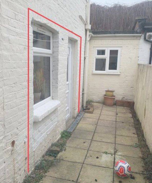 Side return of the flat, with the door and window to be replaced by sliding doors outlined (Design and Access Statement)